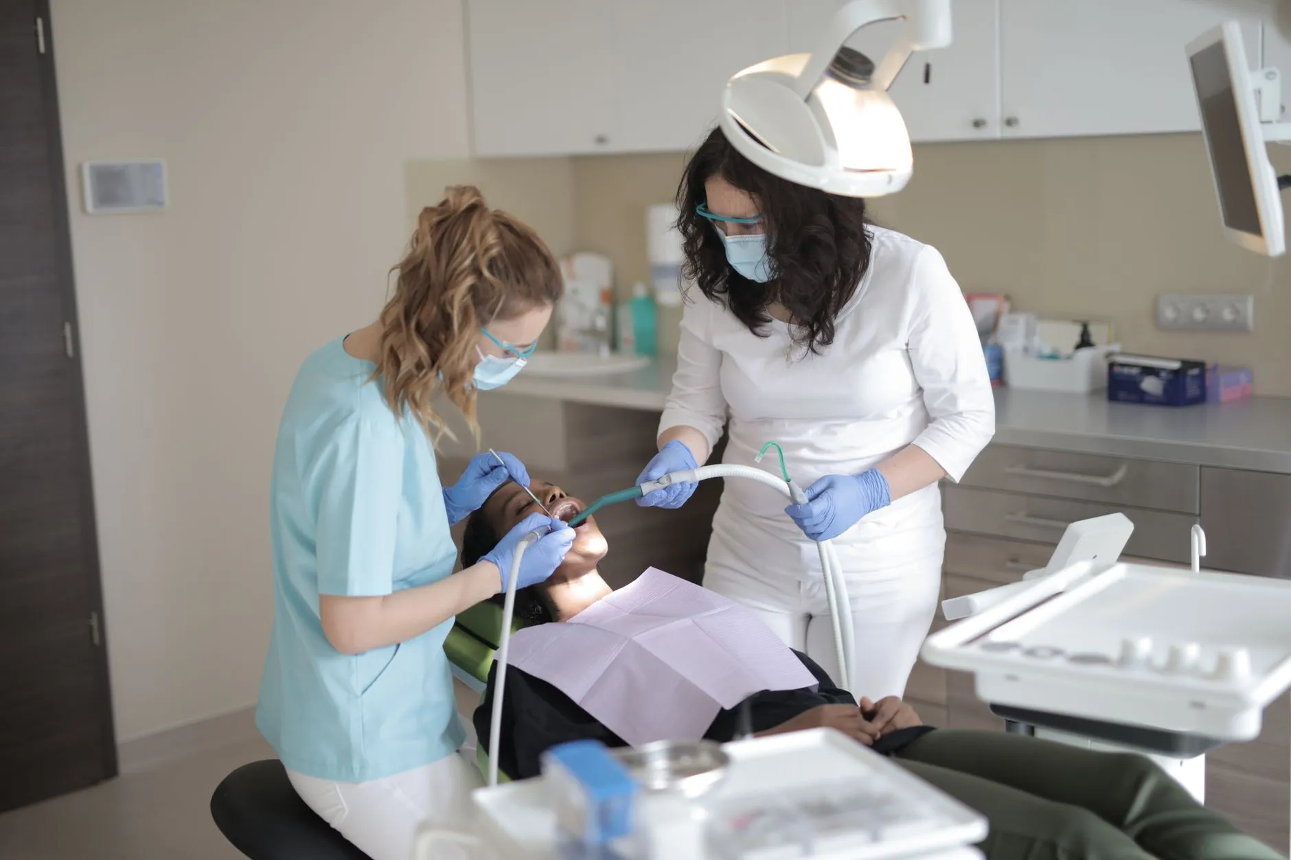 Patient smiling in the dental chair during a fall checkup and cleaning with a general dentist in Round Rock, TX