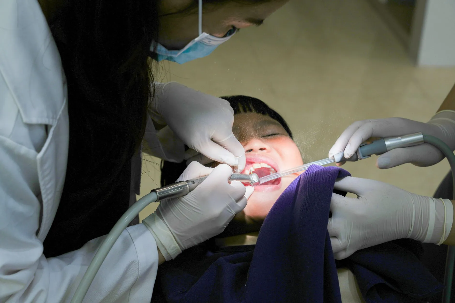 Smiling patient relaxing in the dental chair before root canal treatment at a Round Rock, TX dental office