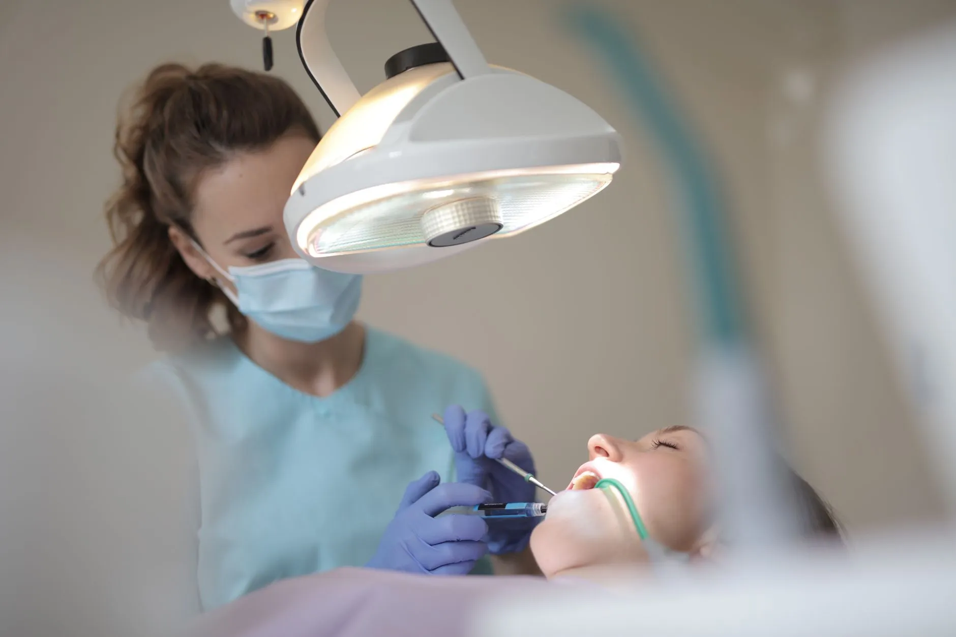 Dentist showing a patient a digital X-ray of a small cavity before a dental filling in Round Rock, TX
