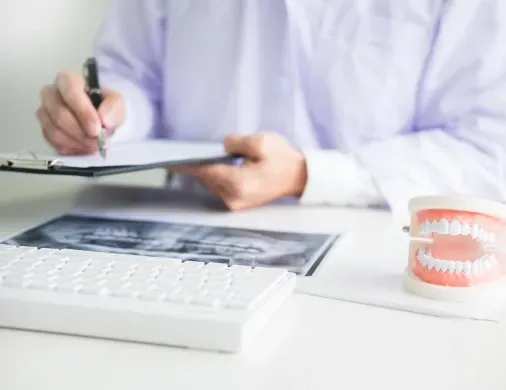 Dental insurance form and X-ray — using dental benefits before year-end at a Round Rock dentist